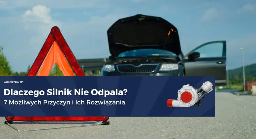 Awaryjny trójkąt i otwarty bagażnik czarnego auta sugerują problem z odpalaniem na ciepłym silniku benzyna.