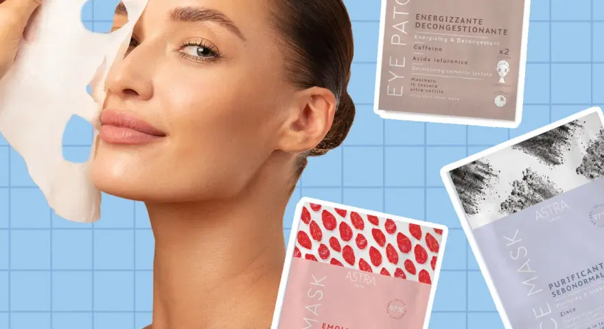 Donna applica una maschera in tessuto sul viso. Diverse confezioni di maschere Astra Skin sono visibili, tra cui una "Eye Patch Energizzante" e due "Face Mask" (una emolliente rivitalizzante e una purificante sebonormale). La maschera in tessuto va ris...