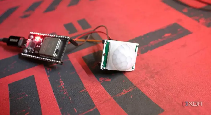 ESP32 board connected to a PIR motion sensor, ready for esp32 presence detection projects.