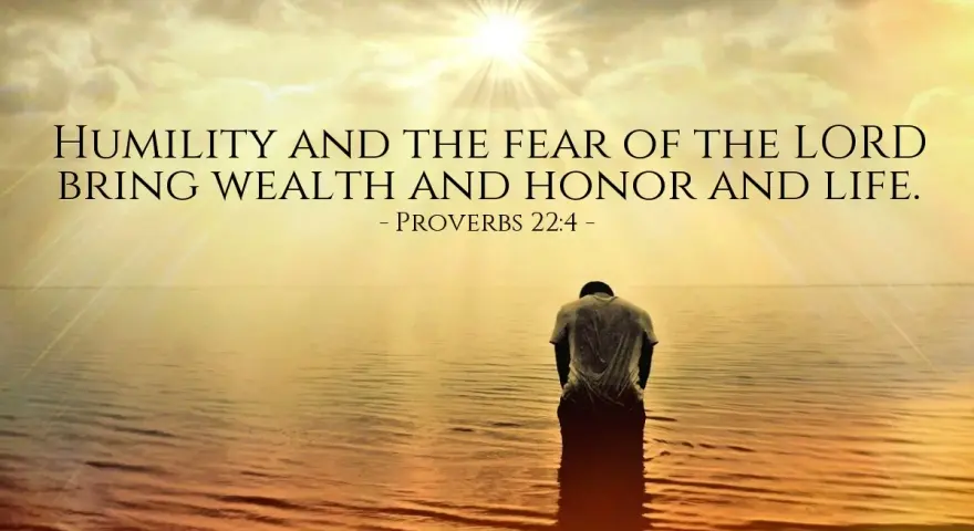 A person kneels in water as the sun shines brightly, illustrating that god lifts up the humble.