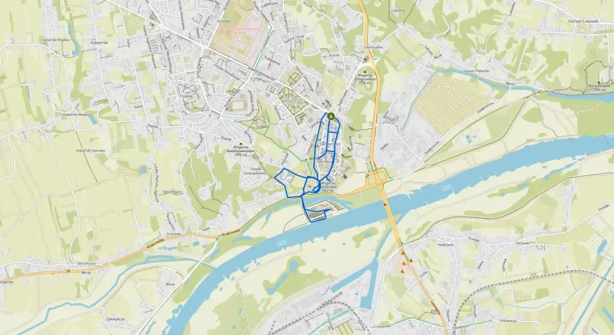 Mapa turystyczna Sandomierza i okolic. Zaznaczony szlak pieszy lub rowerowy, prowadzący przez centrum miasta i wzdłuż Wisły. Atrakcje Sandomierza i okolic.