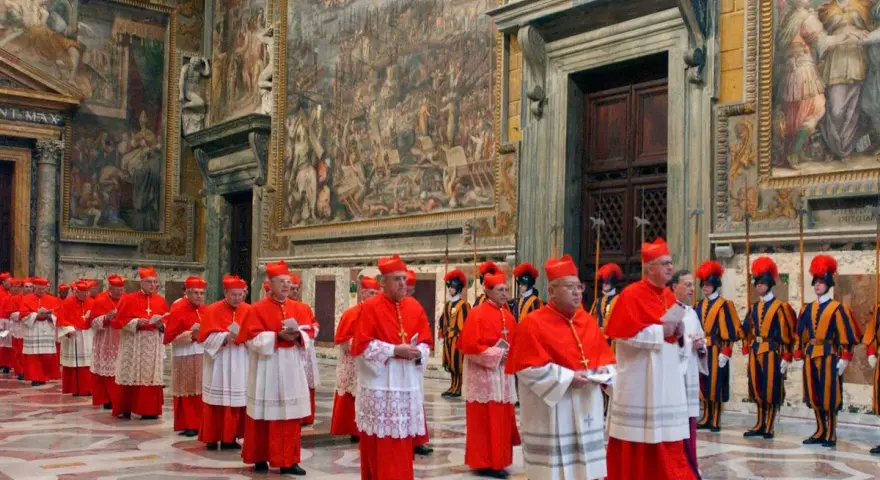 Cardinals in red robes process through a grand hall, a scene hinting at how the Pope is chosen through conclave.