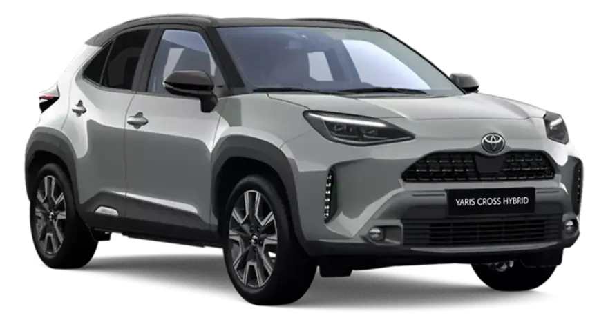 Srebrny Toyota Yaris Cross Hybrid z czarnym dachem, prezentujący nowoczesny design i hybrydowy napęd.
