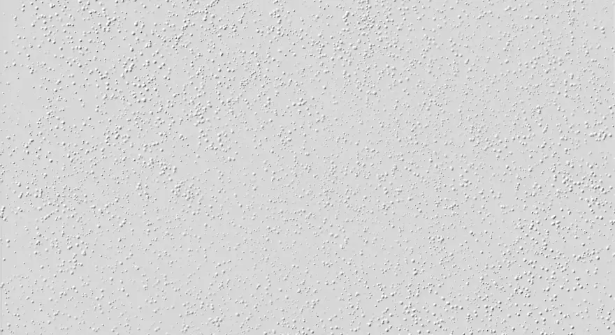 Nahaufnahme einer hellgrauen Raufasertapete mit vielen kleinen, erhabenen Kügelchen. Perfekt, um die Textur vor dem Streichen zu zeigen.