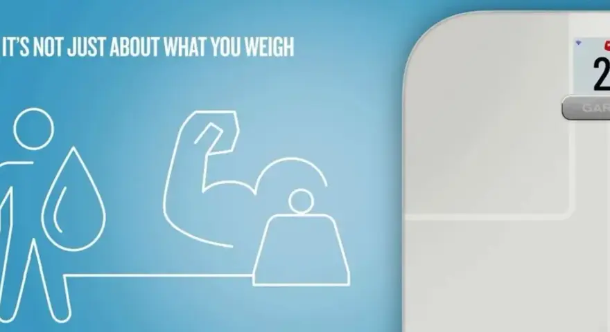 Garmin Index S3 våg visar 28.7 lb, med ikoner för muskler och vatten. Texten "IT'S NOT JUST ABOUT WHAT YOU WEIGH" antyder mer än bara viktmätning.