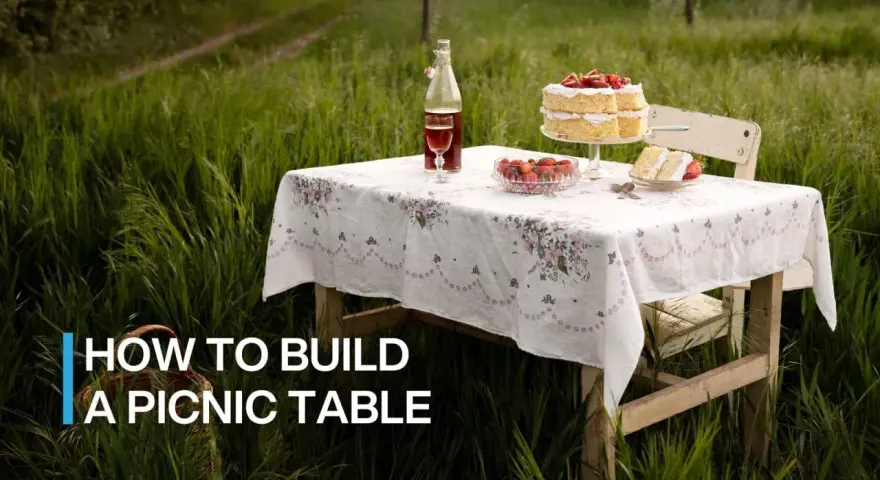 A picnic table set for a sweet treat in a grassy field. Learn how to build a picnic table for your own outdoor gatherings.