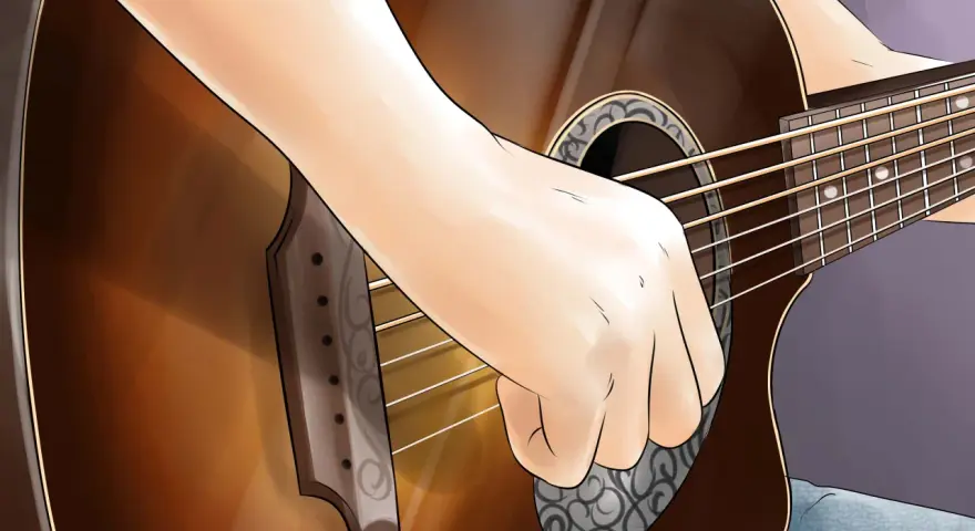 Eine Hand spielt auf einer Gitarre, vielleicht ein Geburtstagslied.