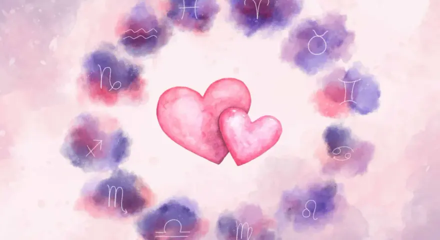 Dwa różowe serca otoczone zodiakalnymi symbolami. Czy to znak, że Rak znalazł idealnego partnera?