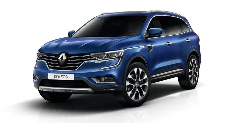 Niebieski Renault Koleos II, który może mieć pewne **awarie i problemy**, prezentuje się elegancko na białym tle.
