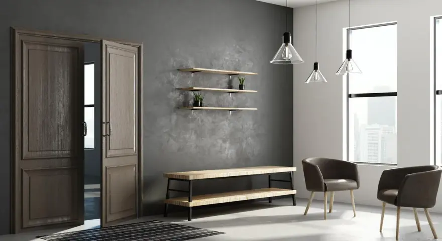 Eleganckie drzwi wewnętrzne z ościeżnicą, które mogą wpłynąć na to, ile kosztują drzwi wewnętrzne z ościeżnicą. Dwa fotele i ława w nowoczesnym wnętrzu.