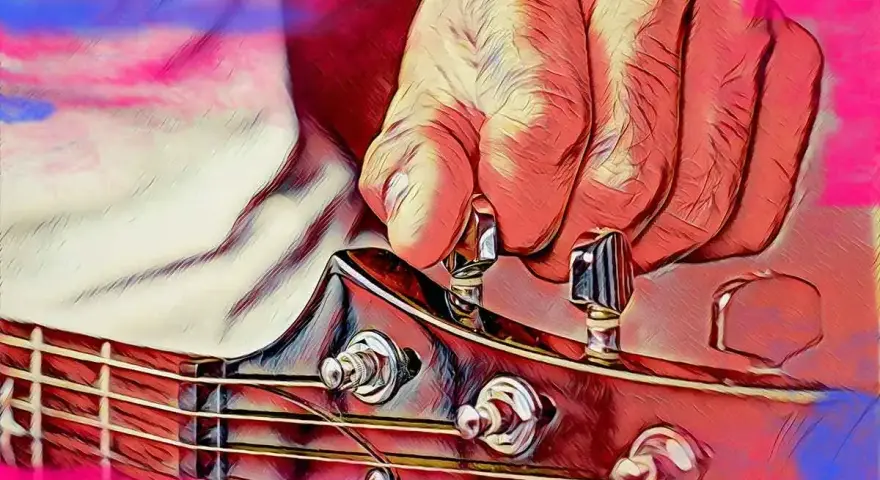 Dłoń stroi gitarę, naciągając struny do idealnego dźwięku a 440 hz.