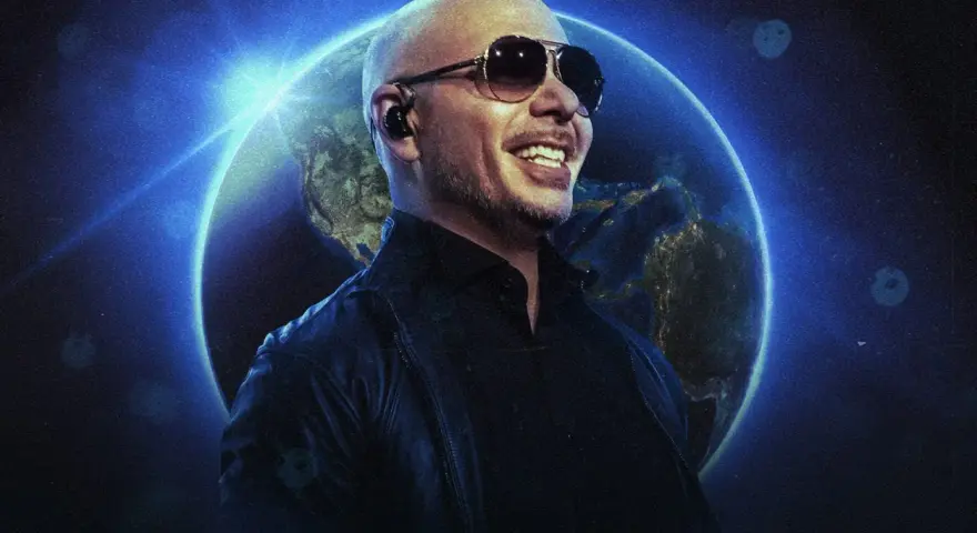 Pitbull w okularach przeciwsłonecznych uśmiecha się na tle Ziemi. To zapowiedź jego światowego koncertu.