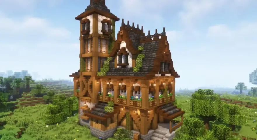 Una mansión de Minecraft con torre alta, tejados de pizarra y madera, rodeada de un paisaje verde y frondoso.