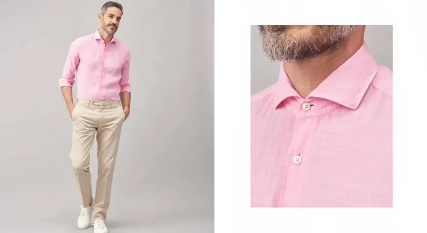 Uomo con camicia rosa e pantaloni beige, un look casual chic. Perfetto per abbinare camicia rosa uomo con stile.