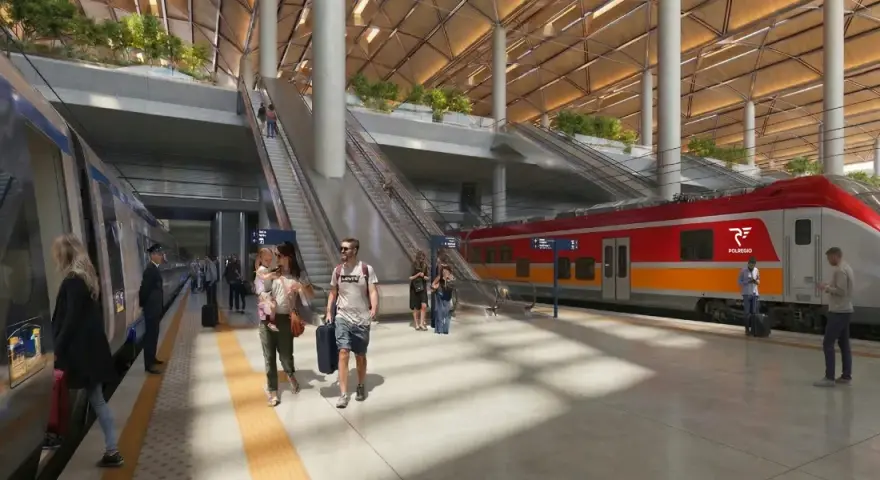 Nowoczesny dworzec kolejowy z pociągiem POLREGIO, pasażerami i schodami ruchomymi.