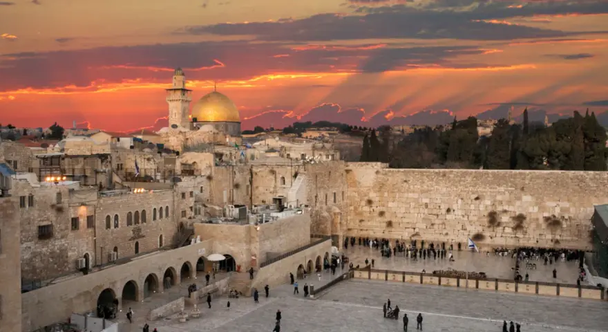 Sunset over Jerusalem's Old City, with the Dome of the Rock and the Western Wall, a glimpse of Solomon's Temple today.