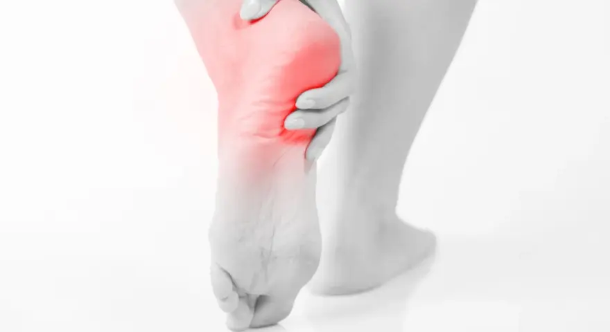 A person's foot with a red highlight on the heel, suggesting pain. This image evokes the relief of soaking an ankle in epsom salt.
