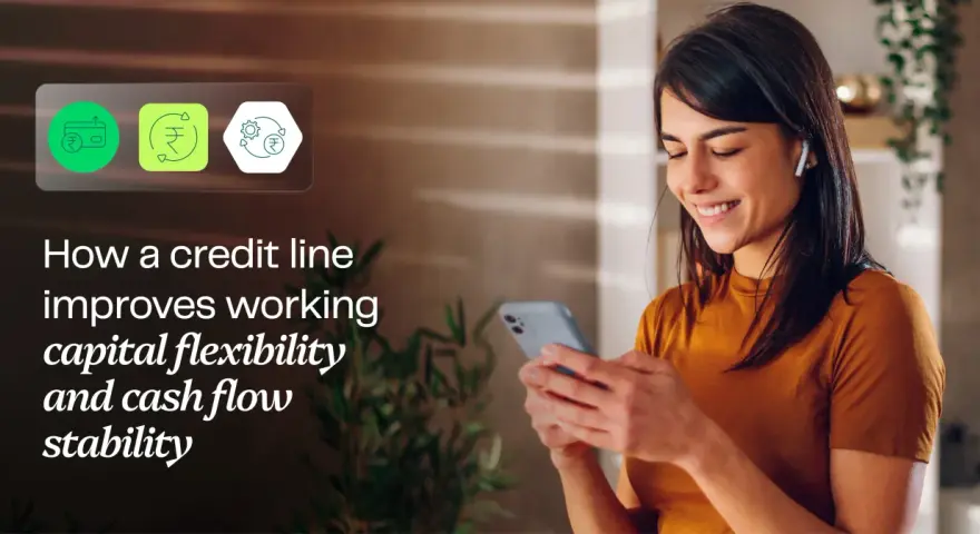 A woman smiles while looking at her phone, with icons representing financial flexibility and a working capital line of credit.