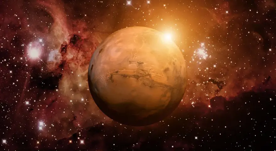 El planeta Marte brilla en el cosmos, rodeado de nebulosas y estrellas. Su superficie rojiza evoca la energía de una marte carta astral, guiando destinos.