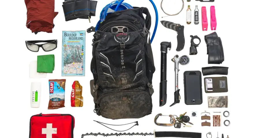 Essential mtb must haves for any adventure: backpack, pump, tools, spare tube, first aid, map, and snacks.