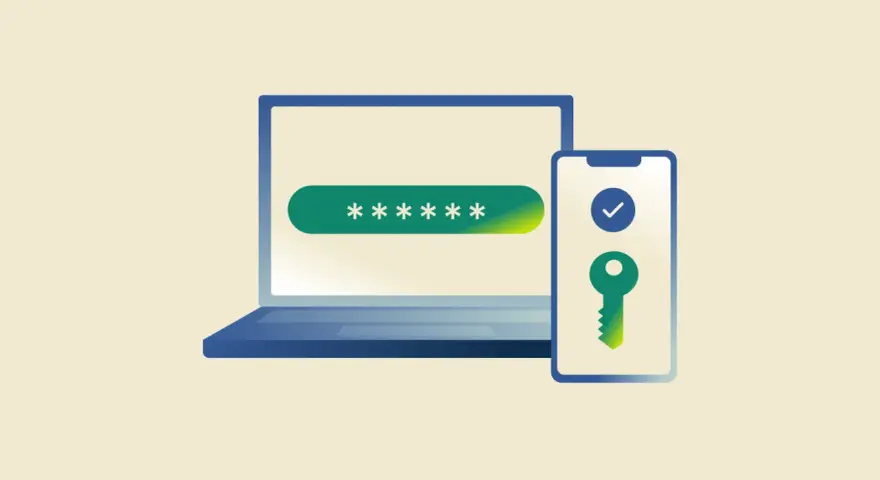 Laptop z polem na hasło i telefon z kluczem symbolizującym zabezpieczenie 2FA.