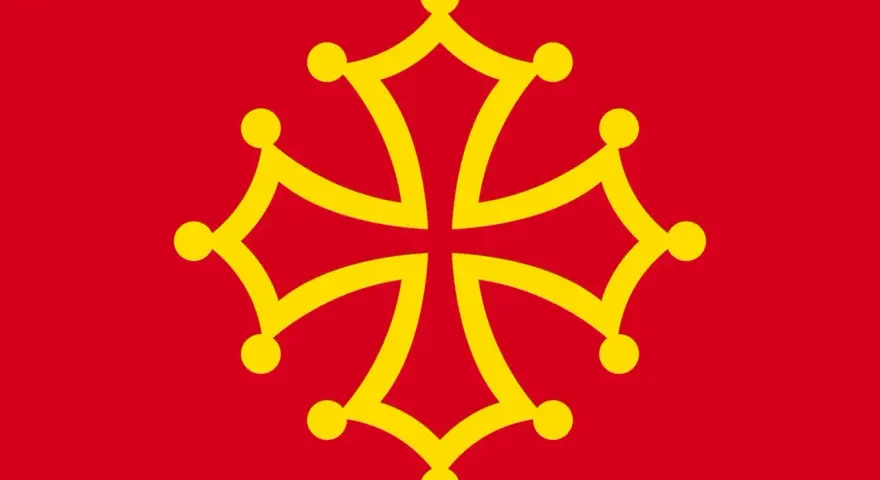 Bandera roja con una cruz amarilla de Occitania, símbolo de la lengua de oil hablada en regiones de Francia.