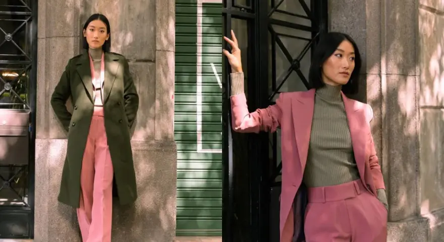 Deux femmes portent des combinaisons vertes et roses. L'une a une veste verte, l'autre une veste rose.