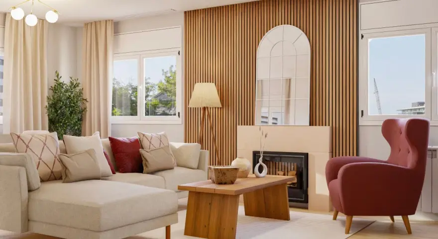 Sofá modular beige, sillón rosa, mesa de centro de madera y chimenea con espejo arqueado. Un espacio con un diseño aesthetic acogedor.