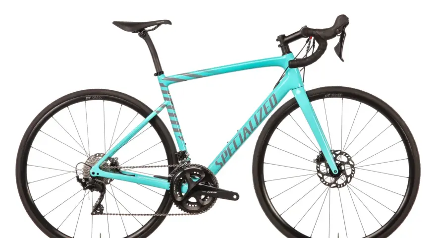 This turquoise Specialized road bike, with its sleek design and disc brakes, proves that specialized bikes are good for performance and style.