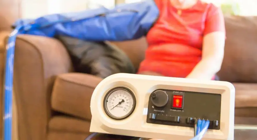A person uses a lymphedema pump on their arm. Consult your doctor about how often you can use your lymphedema pump.
