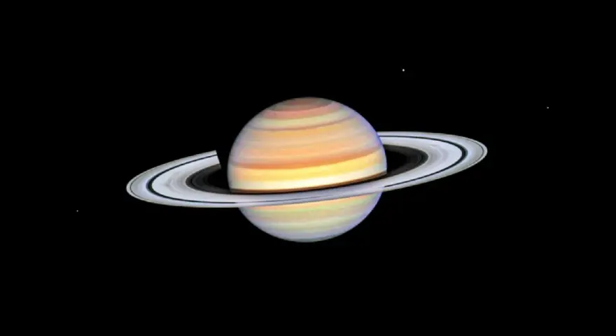 Saturn w Byku, majestatyczny gazowy olbrzym z pierścieniami, unoszący się w kosmicznej pustce.