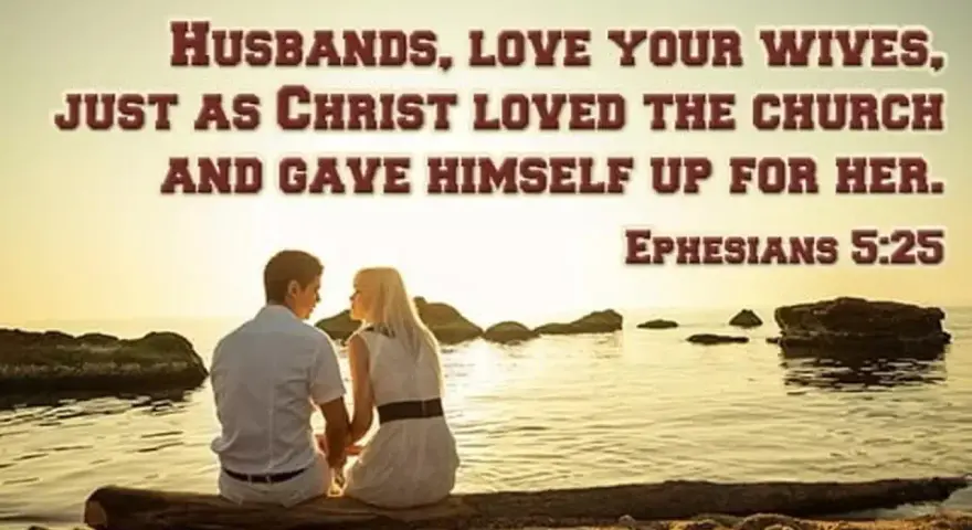 A couple sits by the sea, embodying the biblical definition of love as husbands love their wives as Christ loved the church. Ephesians 5:25.