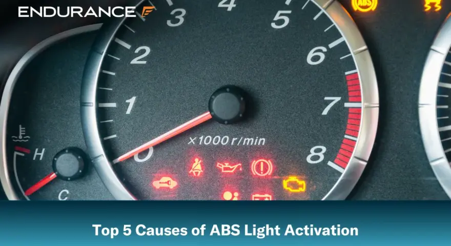 Dashboard with illuminated ABS light and other warning indicators. Learn the top 5 causes of ABS light activation.