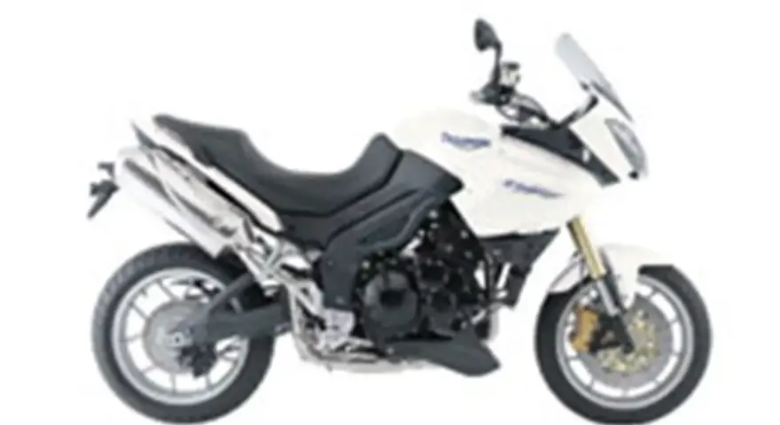Biały motocykl turystyczny Triumph Tiger 1050. Poznaj jego dane techniczne i możliwości.