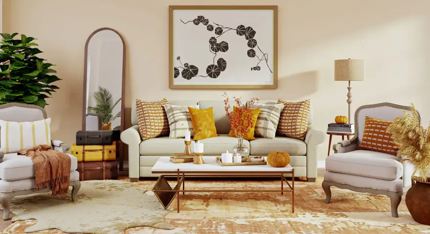 Acogedor salón con sofá, sillones y mesa de centro. Destaca una **gama colores cálidos** en cojines, mantas y decoración otoñal.