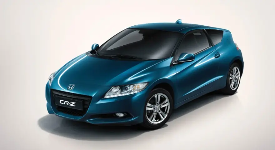 Błękitny Honda CR-Z z błyszczącym lakierem, prezentujący sportowy design i hybrydową moc.