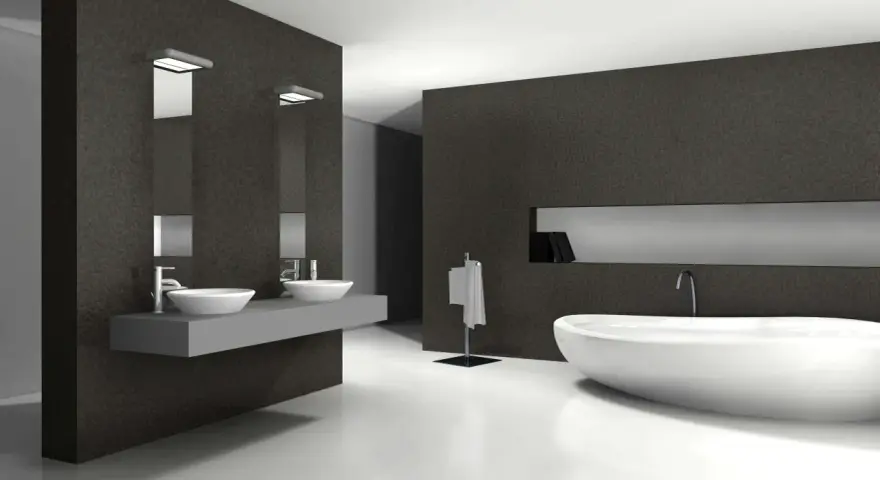 Élégante salle de bain blanc et noir avec baignoire îlot, double vasque et porte-serviettes.