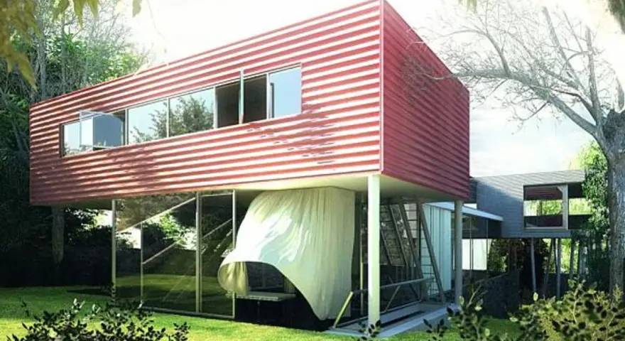 Villa Dall'Ava, une maison moderne aux lignes épurées, avec un étage supérieur rouge à rayures blanches, suspendu au-dessus d'un rez-de-chaussée vitré.