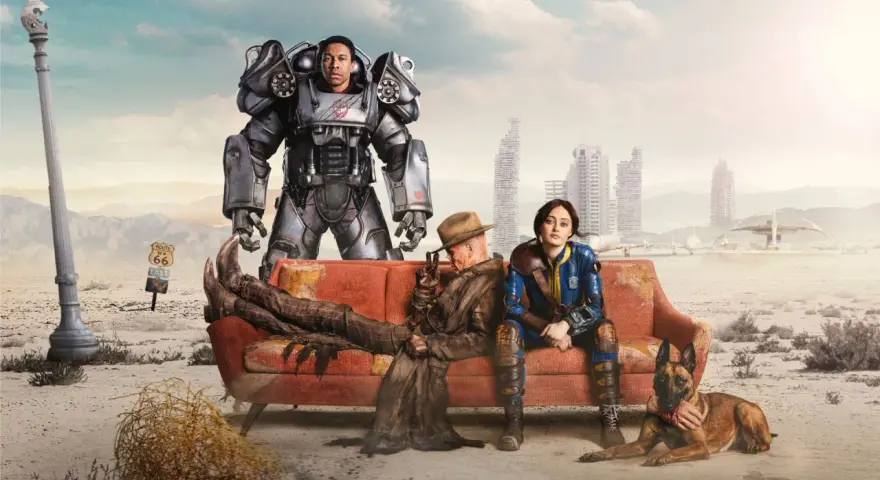 Postapokaliptyczna ekipa na kanapie, czekająca na Fallout 5. W tle zniszczone miasto i znak Route 66.