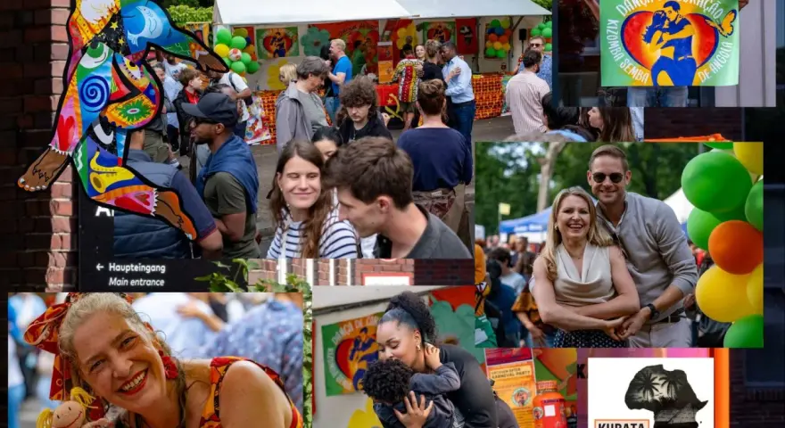 Bunte Kunstfigur und fröhliche Menschen beim **Carnival Berlin**. Ein Mann hält ein Plakat mit der Aufschrift "Danza de Coração".