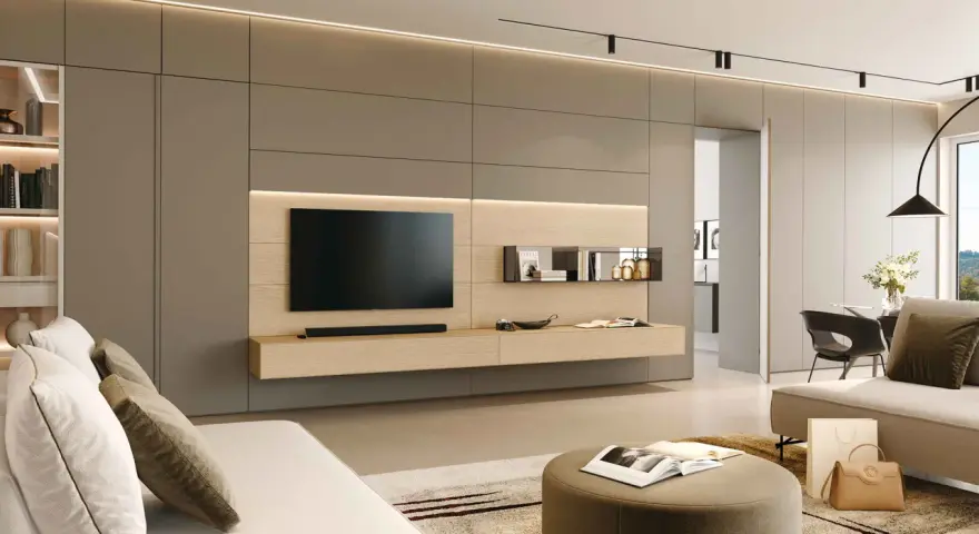 Ecco come arredare una parete attrezzata moderna: un mobile sospeso in legno chiaro con TV, mensole minimaliste e illuminazione integrata.