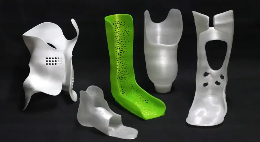 A collection of orthopedic devices, including braces and prosthetic components, showcase the versatility of polypropylene 3D printing.