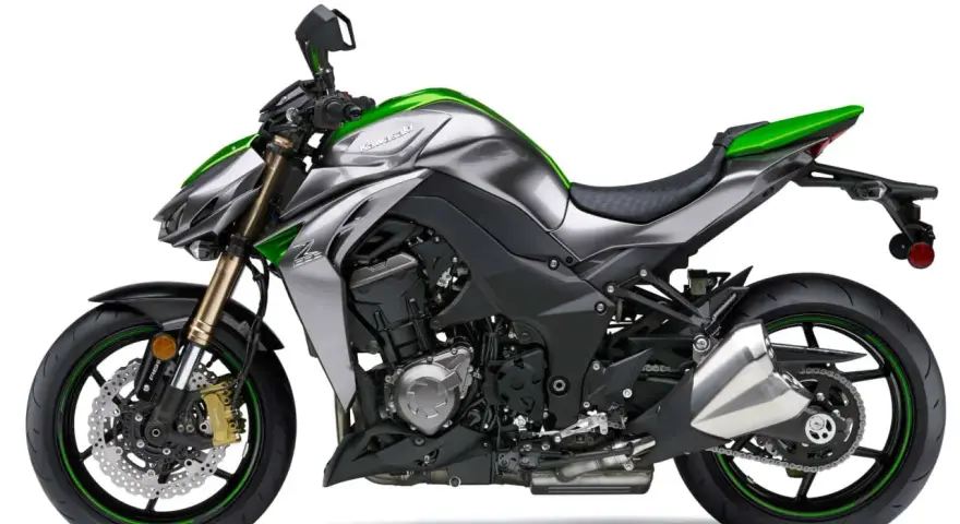 Srebrno-zielony Kawasaki Z1000 z agresywnym designem, gotowy do podboju dróg.
