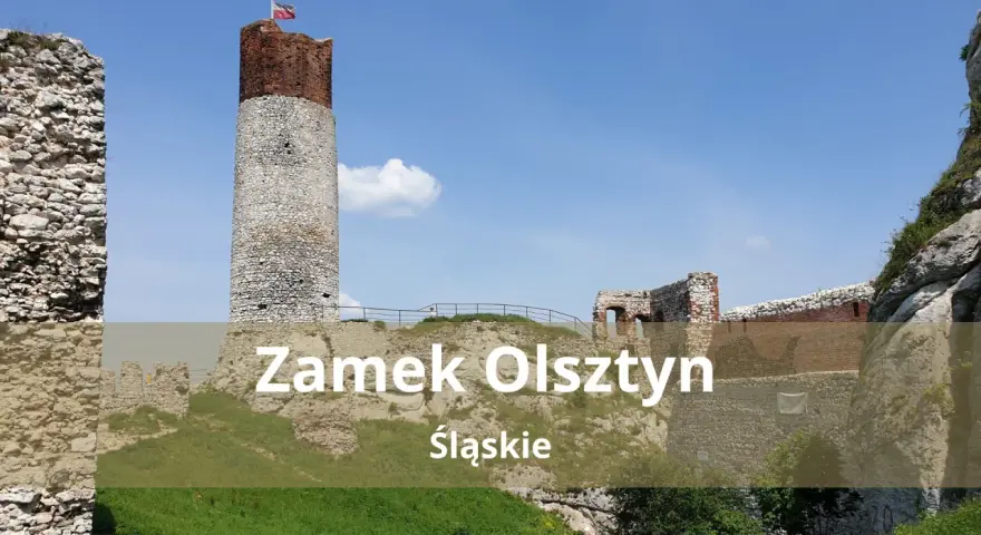 Zamek Olsztyn, ruiny średniowiecznej warowni na Jurze Krakowsko-Częstochowskiej, dumnie wznosi się na tle błękitnego nieba.
