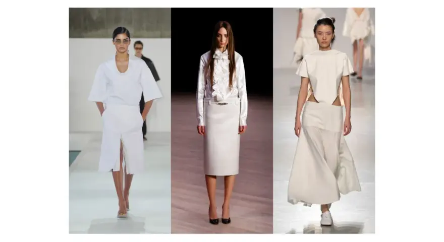 Sfilata di moda con tre modelle che indossano abiti eleganti in **dress code total white**. Gonne lunghe e top asimmetrici.