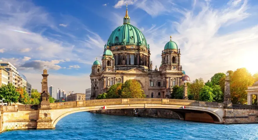 A stunning view of Berlin Cathedral across the Spree River, perfect for your next travel to Berlin.