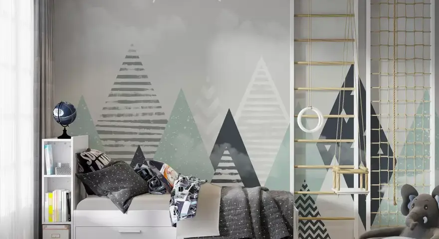 Habitación infantil con pared que simula pintar montañas, cama, estantería y zona de juegos con columpio.