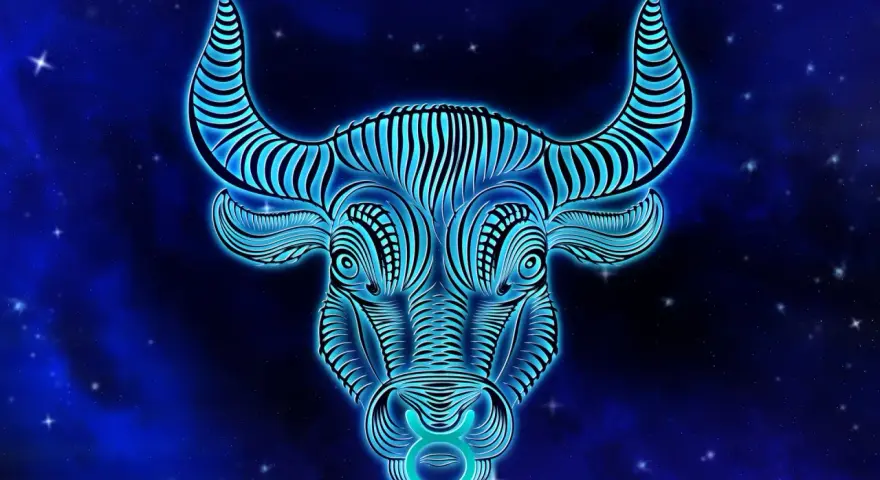 Błękitny, neonowy byk z gwiazdami na tle. Symbol zodiaku Byk, jaki żywioł? Ziemia, siła i stabilność.