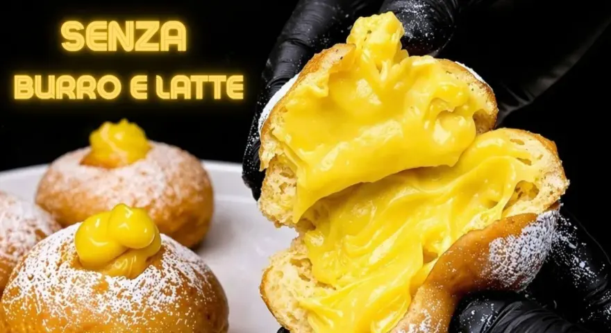 Bomboloni alla crema, soffici e ripieni, senza burro e latte. Un'esplosione di dolcezza.