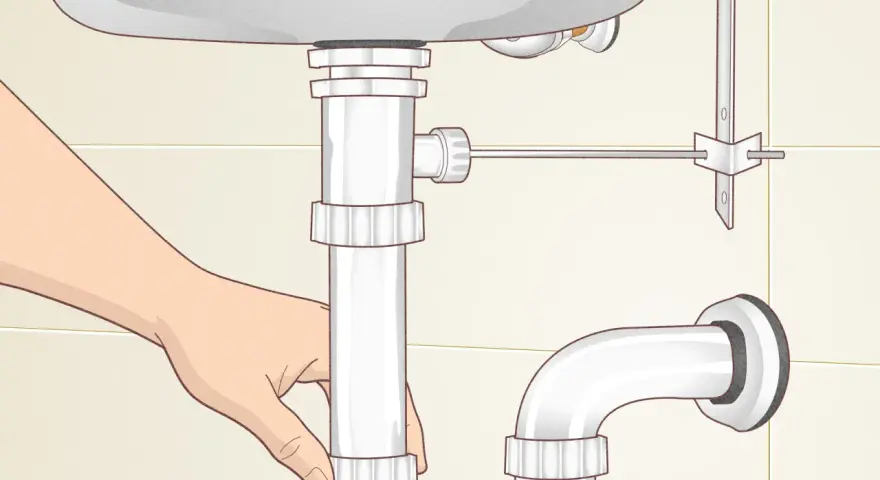 A hand loosens a pipe fitting under a sink, showing how to remove sink stopper.